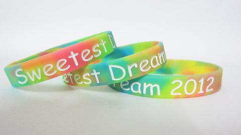 WDM224P - Debossed with colorfilled Swirl Silicone Wristband - WDM Promos